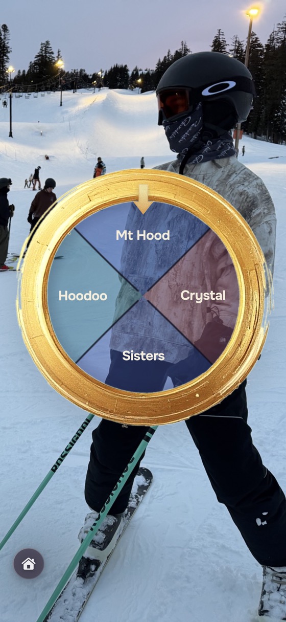 A wheel under the Cosmic gold-rim dial, set behind a photo from a ski day
